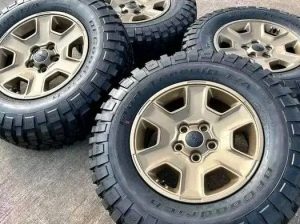 17 jeep Wrangler Rubicon OEM 
Bronze wheels and tires

Asking $ 900